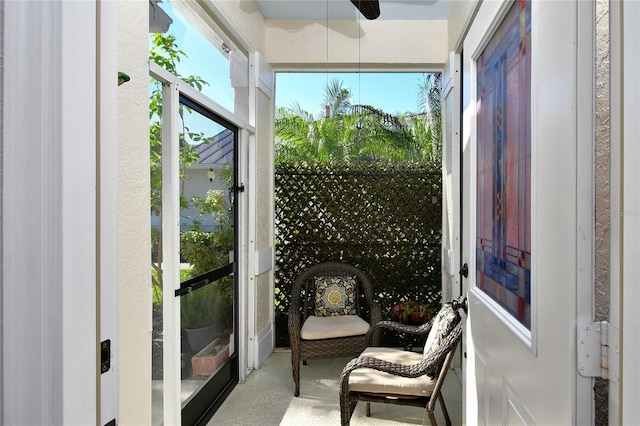 interior space with ceiling fan