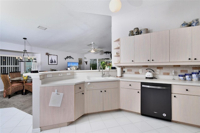 kitchen featuring ceiling fan, sink, backsplash, black dishwasher, and decorative light fixtures