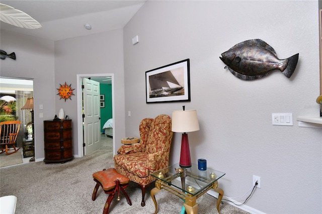 sitting room with light colored carpet