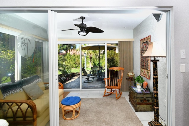 sunroom / solarium with ceiling fan