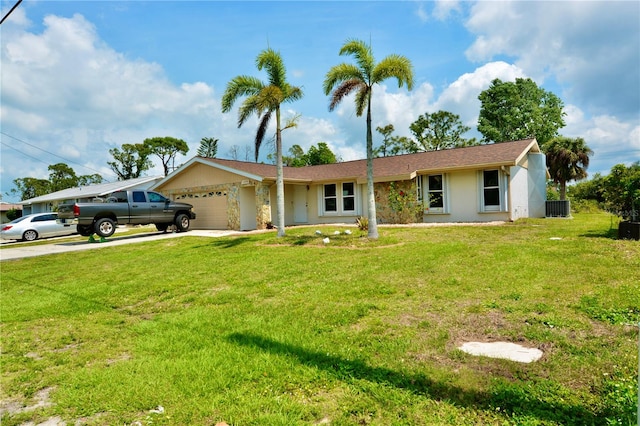 single story home with a garage, central AC, and a front lawn