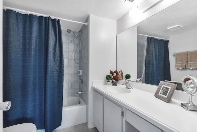 bathroom with shower / bathtub combination with curtain, tile patterned flooring, and vanity