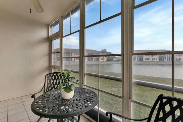 sunroom with a water view and plenty of natural light