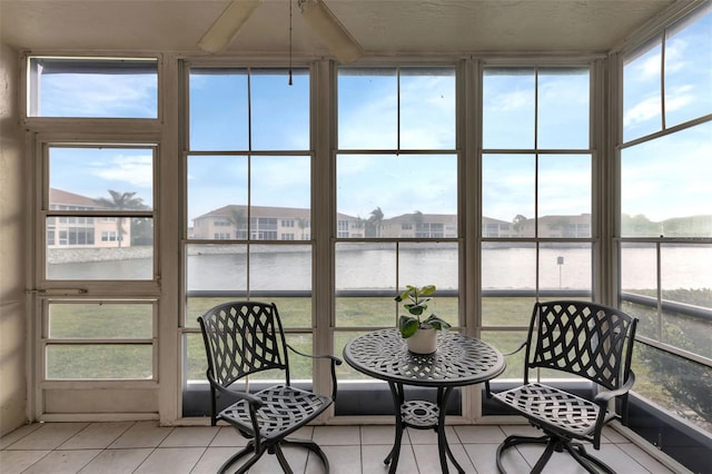 sunroom with a water view