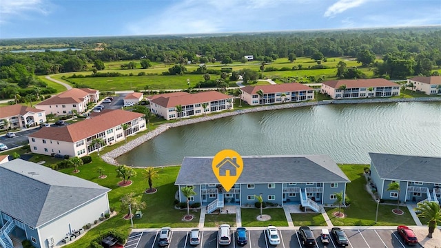 birds eye view of property featuring a water view