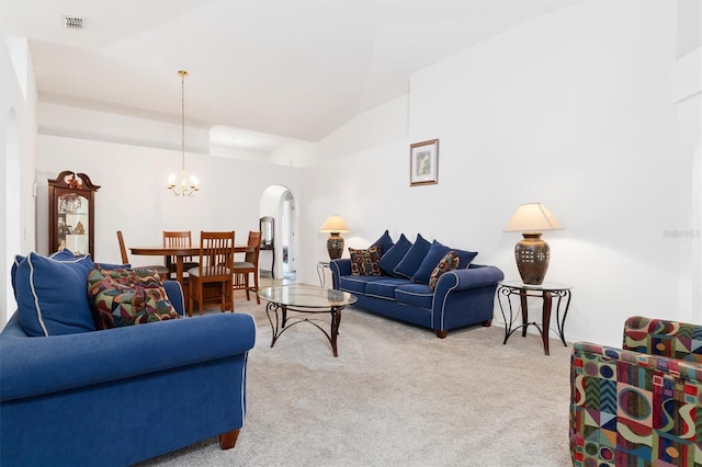 living room featuring light carpet, lofted ceiling, and a notable chandelier