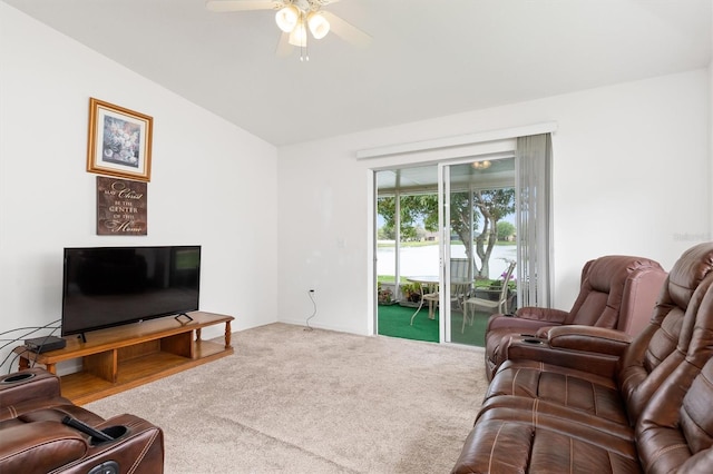 living room with ceiling fan and carpet