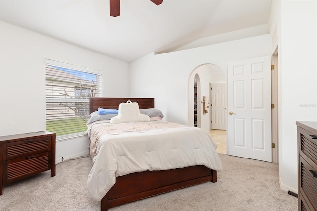 carpeted bedroom with vaulted ceiling and ceiling fan