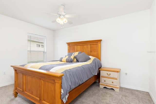 bedroom with light carpet and ceiling fan