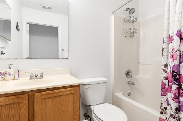 full bathroom featuring toilet, vanity, and shower / bath combo with shower curtain