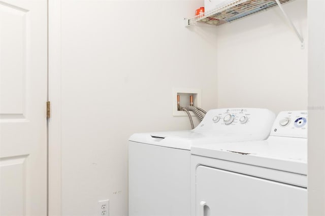 laundry room with separate washer and dryer