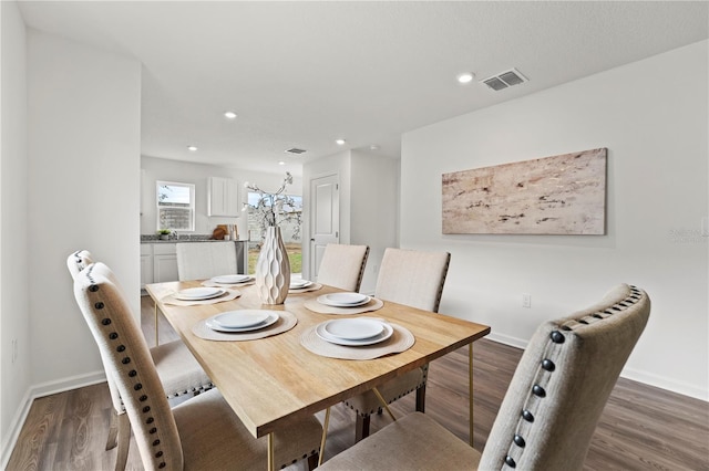 dining area with dark wood-type flooring