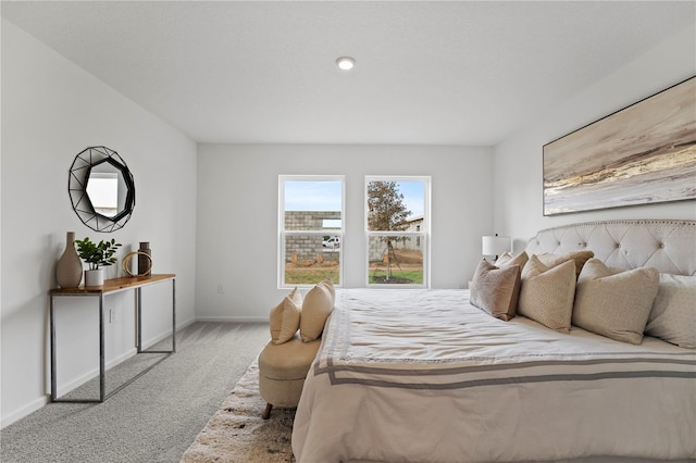 bedroom with light colored carpet