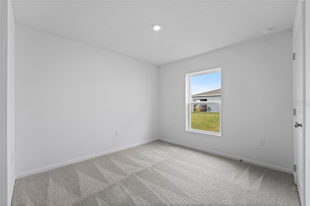 spare room featuring carpet flooring