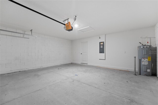 garage featuring a garage door opener, electric panel, and electric water heater