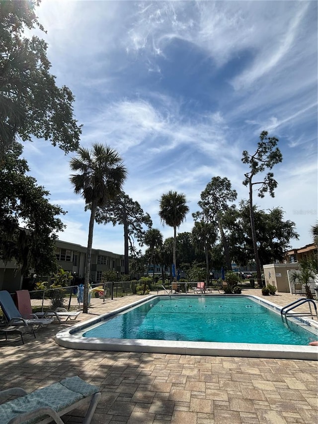 view of pool featuring a patio