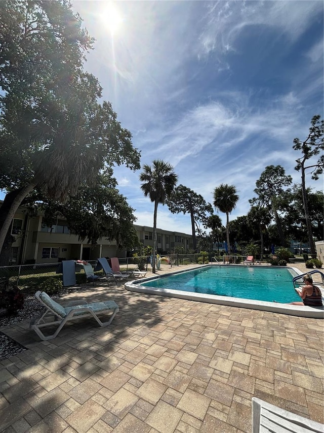 view of swimming pool featuring a patio area