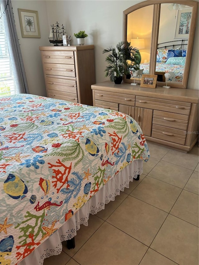 bedroom with light tile floors