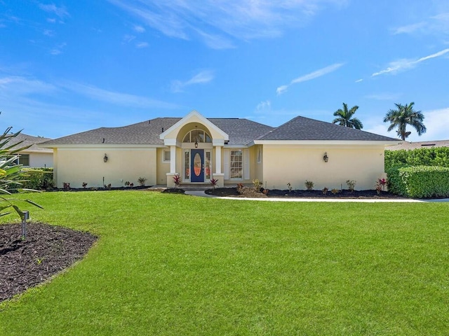 ranch-style house featuring a front yard