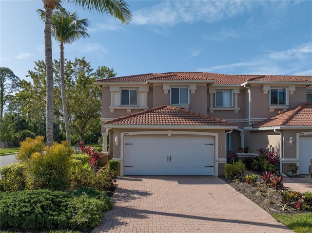 mediterranean / spanish-style house featuring a garage