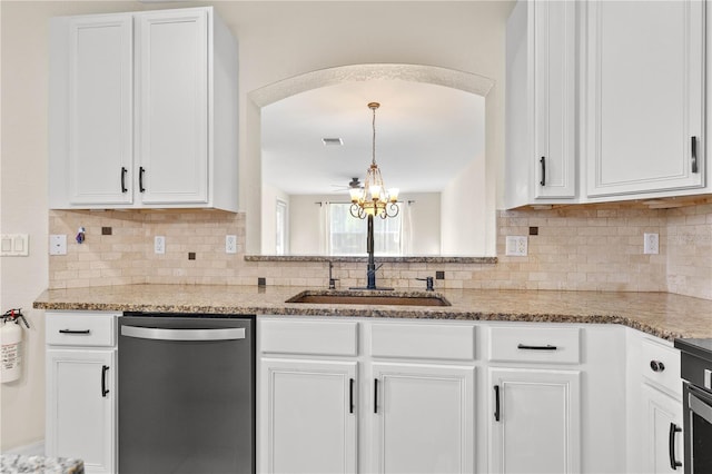 kitchen with backsplash, dishwasher, white cabinets, and sink