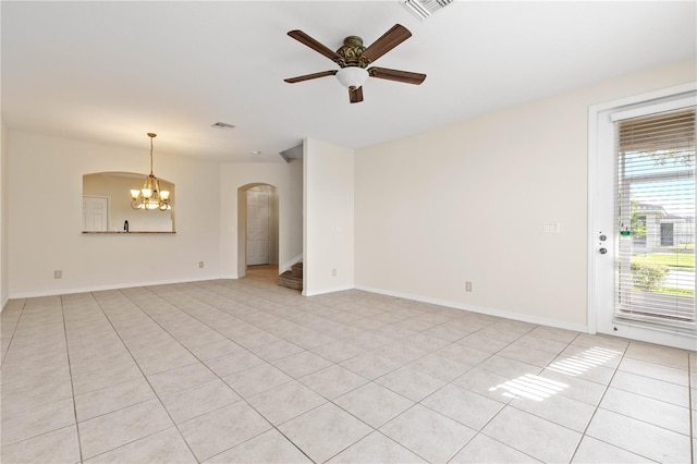 unfurnished room featuring light tile patterned floors and ceiling fan with notable chandelier