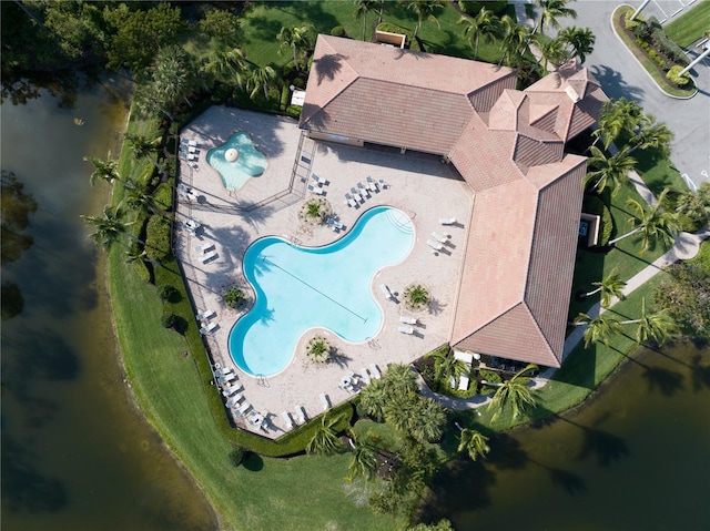 birds eye view of property with a water view