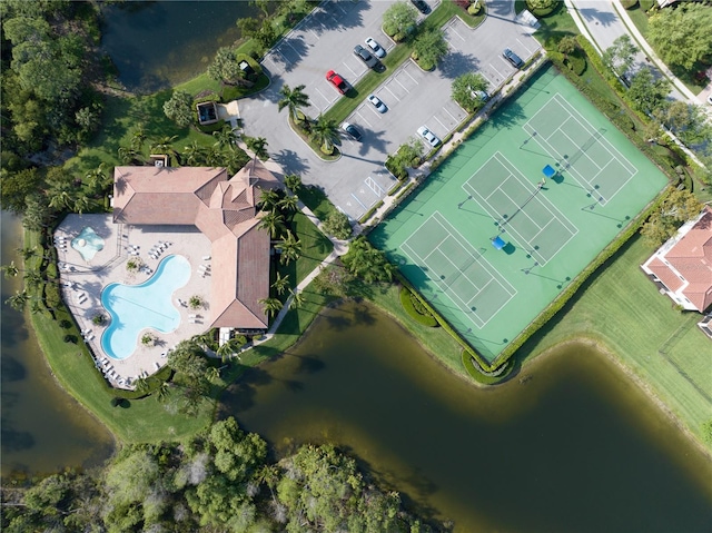 birds eye view of property with a water view