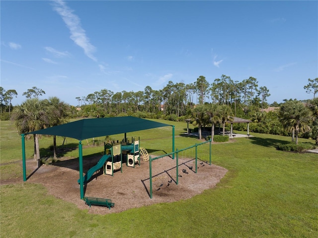 view of jungle gym featuring a lawn