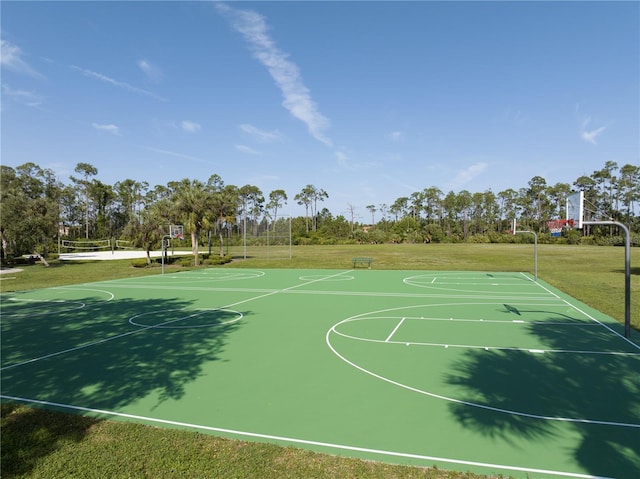 view of basketball court featuring a lawn