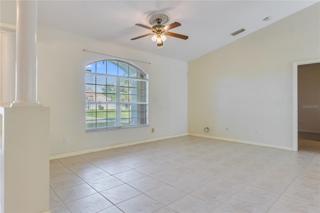 tiled empty room with ceiling fan and ornate columns