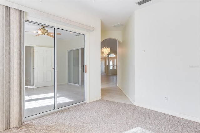 unfurnished room featuring light colored carpet and ceiling fan