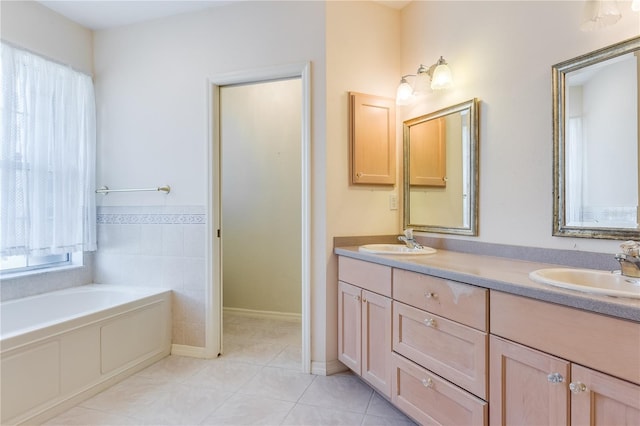 bathroom featuring a bath to relax in, tile floors, and double sink vanity