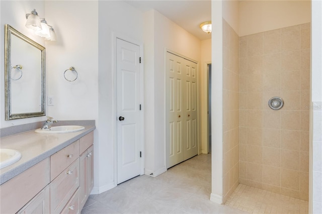 bathroom featuring tile flooring, double sink, and large vanity