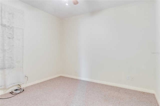 empty room with light colored carpet