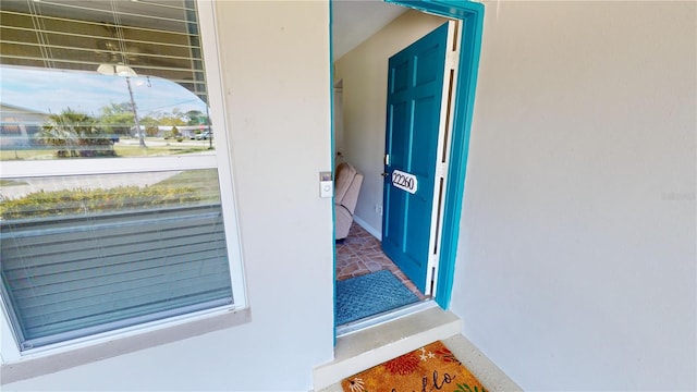 entrance to property with a balcony