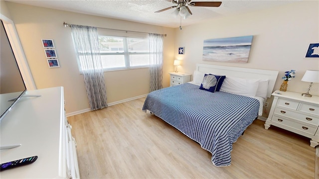 bedroom featuring ceiling fan and light wood-type flooring