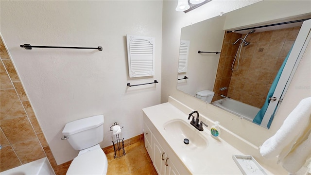 full bathroom with tiled shower / bath, toilet, tile floors, and oversized vanity