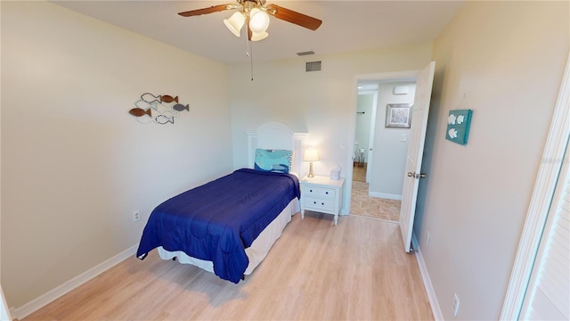 bedroom with light hardwood / wood-style flooring and ceiling fan