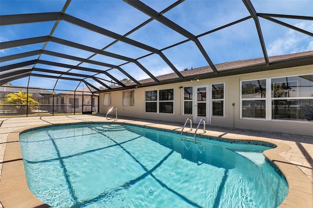 view of pool with a lanai and a patio area