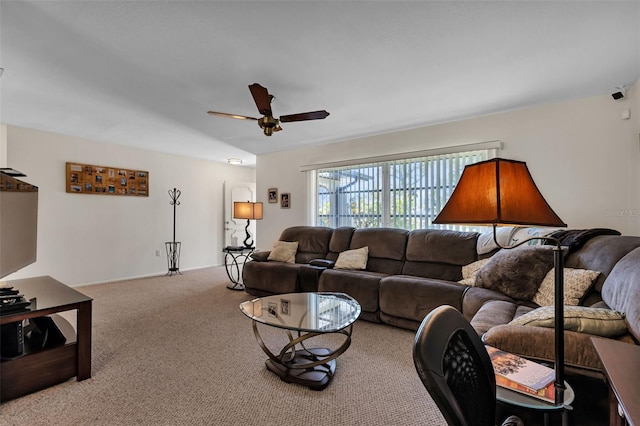 carpeted living room with ceiling fan