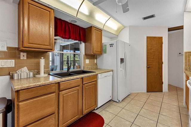 kitchen with ceiling fan, sink, tasteful backsplash, light tile patterned flooring, and white appliances