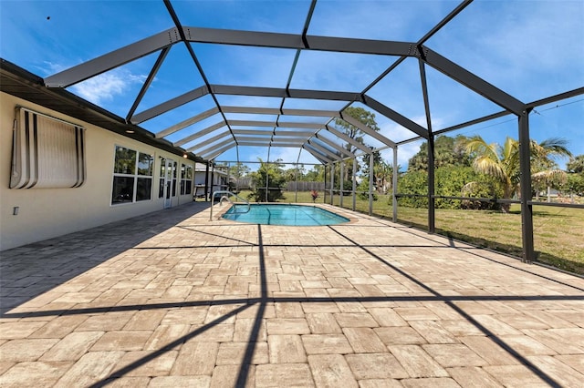 view of swimming pool with a patio and a lanai