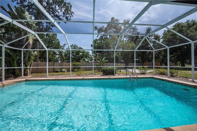 view of pool with a lanai