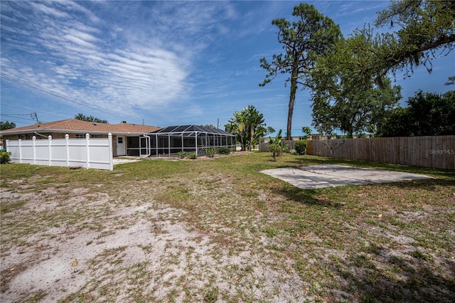 view of yard with a patio and a lanai