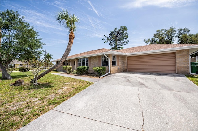 ranch-style house with a garage and a front yard