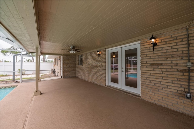 view of patio featuring ceiling fan and french doors