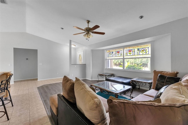 tiled living room featuring vaulted ceiling and ceiling fan