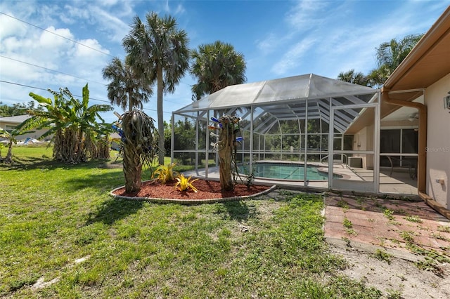 view of yard featuring a lanai and a patio