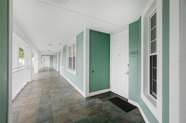 hall with a textured ceiling